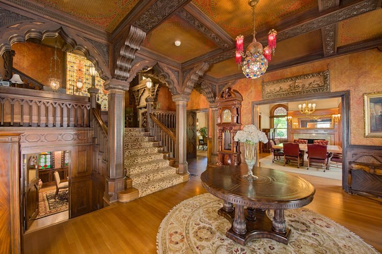 Carved woodwork and grand staircase at Patsy Clark Mansion