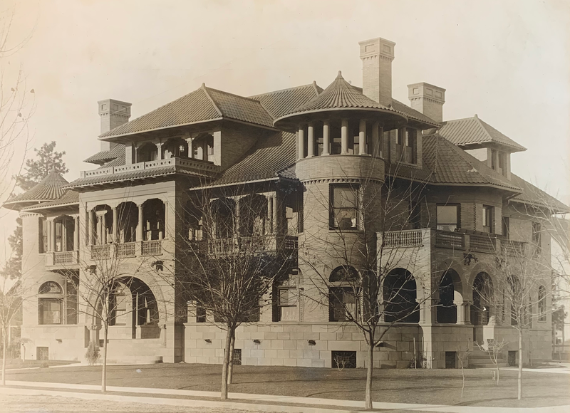 Historic exterior photograph of the Patsy Clark Mansion, showing its original rooflines and balconies