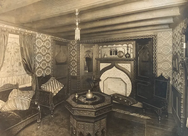 Archival photograph of an elaborately decorated room in the Patsy Clark Mansion